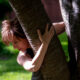 JDPP Dancer Lisa Matias hugs tree